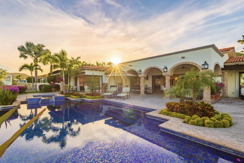 Cabo del Sol Brisas Discover Naah Payil, an exceptional estate where the warmth of a Contemporary Mexican Hacienda blends seamlessly with the relaxed sophistication of coastal living. Located within one of Los Cabos' most exclusive and secure communities, this architectural masterpiece was custom-designed by MCA, led by renowned architect Antonio Carrera. Thoughtfully enhanced in 2015 and again in 2025, the residence beautifully balances timeless character with today's highest standards of comfort and design. At the heart of the home, a central courtyard anchored by a signature tree creates a tranquil gathering space filled with natural light. The home's thoughtful design embraces effortless indoor-outdoor living. Open the grand living room doors, and refreshing ocean breezes naturally flow throughout the residence, creating a comfortable and inviting atmosphere – 12 Cabo del Sol Brisas, Cabo Corridor, BS
