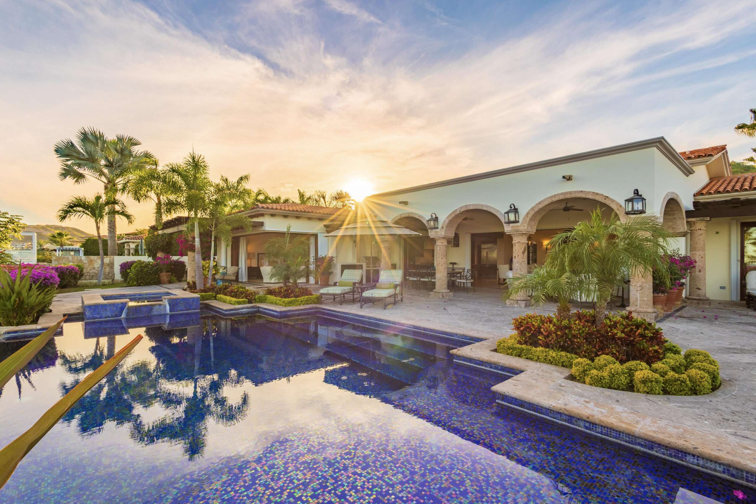 Cabo del Sol Brisas Discover Naah Payil, an exceptional estate where the warmth of a Contemporary Mexican Hacienda blends seamlessly with the relaxed sophistication of coastal living. Located within one of Los Cabos' most exclusive and secure communities, this architectural masterpiece was custom-designed by MCA, led by renowned architect Antonio Carrera. Thoughtfully enhanced in 2015 and again in 2025, the residence beautifully balances timeless character with today's highest standards of comfort and design. At the heart of the home, a central courtyard anchored by a signature tree creates a tranquil gathering space filled with natural light. The home's thoughtful design embraces effortless indoor-outdoor living. Open the grand living room doors, and refreshing ocean breezes naturally flow throughout the residence, creating a comfortable and inviting atmosphere for sale